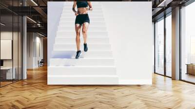 Fitness woman doing workout running down the stairs Wall mural