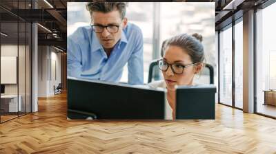 Focused business team using a computer in office Wall mural