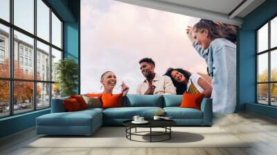 Four friends dancing on the rooftop Wall mural