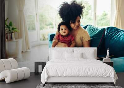 Freelancer working at home during maternity leave Wall mural