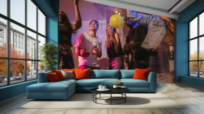 Friends dancing at a house party Wall mural