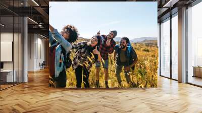 Friends taking selfie on hiking trip Wall mural