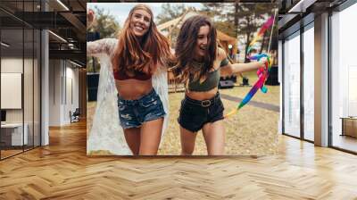 Girls having fun at music festival Wall mural