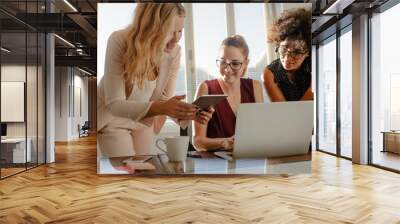 Group of businesswoman working over a new project Wall mural