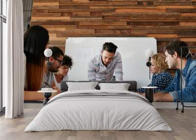 Group of colleagues having a brainstorming session Wall mural