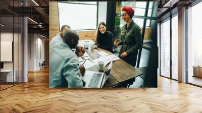 Group of diverse businesspeople having a meeting in an office boardroom Wall mural