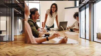 Group of multi ethnic executives discussing during a meeting Wall mural