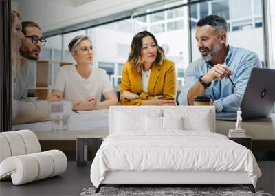 Group of multicultural designers having a meeting in an office Wall mural