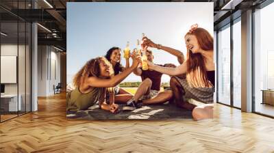 Group of young people partying outdoors Wall mural