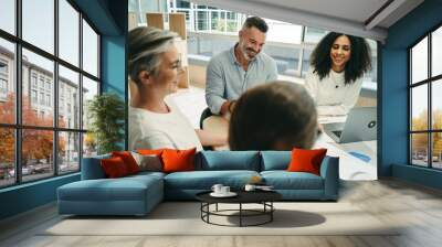 Happy businesspeople having a meeting in a co-working office Wall mural