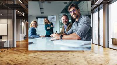 Happy group of businesspeople during presentation Wall mural