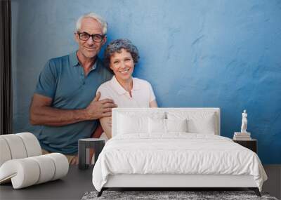 Happy mature couple standing together Wall mural