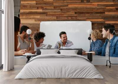 Happy young business people meeting in conference room Wall mural