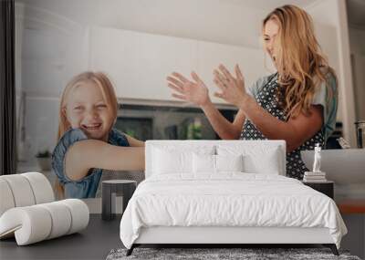 Happy young family having fun in kitchen Wall mural