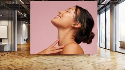 Happy young woman with healthy skin Wall mural