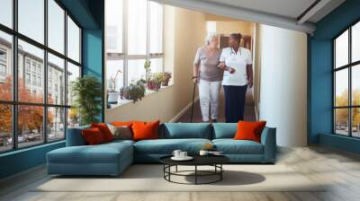 Healthcare work helping female patient. Wall mural