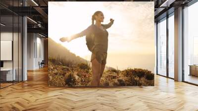 Hiker feeling happy during a hike Wall mural