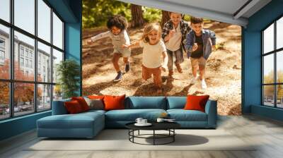 Kids running up in the forest Wall mural