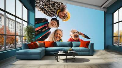 Low angle view of cheerful elderly people laughing with joy Wall mural