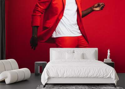 Man dancing on red background Wall mural