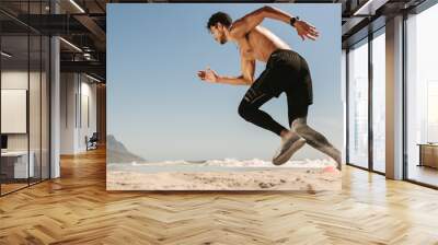 Man running on the beach Wall mural