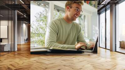 Man working remotely from home Wall mural