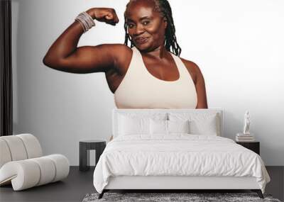 Mature black woman flexing her bicep while standing against a transparent background Wall mural