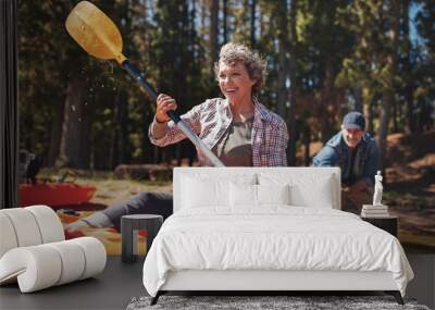 Mature couple enjoying a day at the lake with kayaking Wall mural