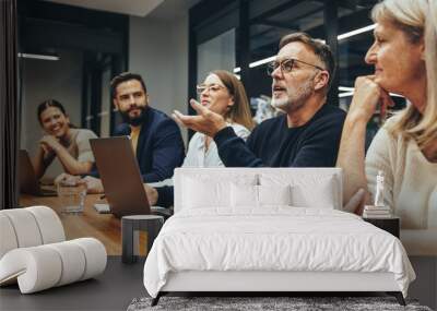 Mature manager leading a discussion in a boardroom Wall mural