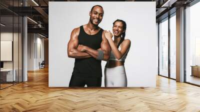 Monochrome fitness portrait of fit couple Wall mural