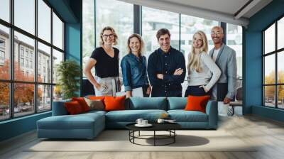 Multi-ethnic business team smiling in office Wall mural