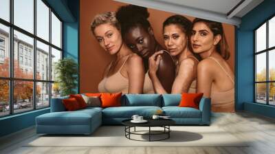 Multi ethnic female friends standing together Wall mural