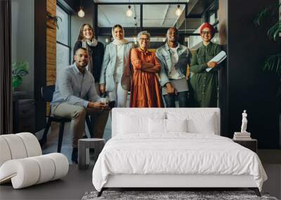 Multicultural business team smiling at the camera in an office Wall mural