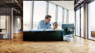 Office worker working together on computer Wall mural