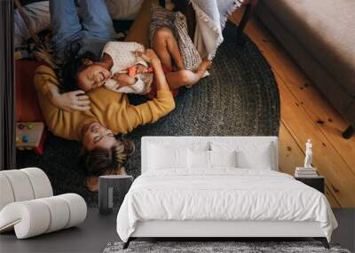 Overhead view of a mother and her daughter laughing happily Wall mural