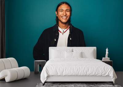 Portrait of a confident native man with braided hair and stylish jewelry Wall mural