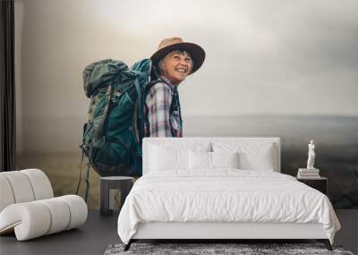 Portrait of an excited female trekker Wall mural