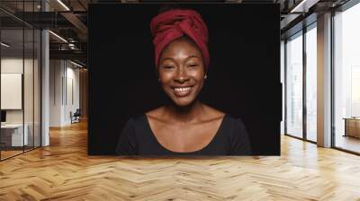 portrait of smiling african woman in a headwrap Wall mural