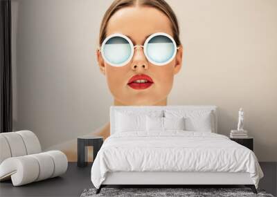 Pretty young woman with glasses Wall mural