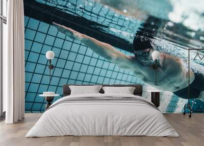 pro swimmer practising in swimming pool Wall mural