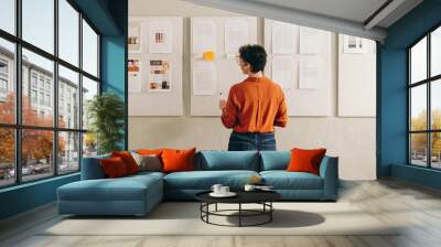 Rearview of a businesswoman giving a presentation during a conference call Wall mural