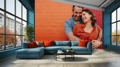 Romantic couple together on multicolored wall Wall mural