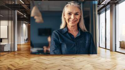 senior business woman in office Wall mural