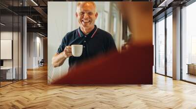 Senior businessman having coffee break Wall mural