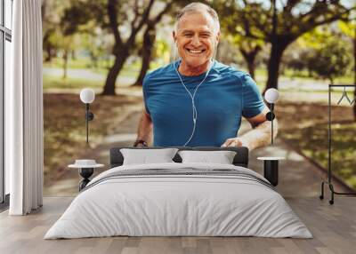 Senior man going for a run and living a healthy lifestyle for longevity Wall mural