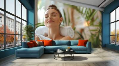 Serene woman blissfully receiving a deep tissue massage in a tranquil day spa environment Wall mural