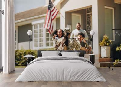 Servicewoman embracing her children on her homecoming Wall mural