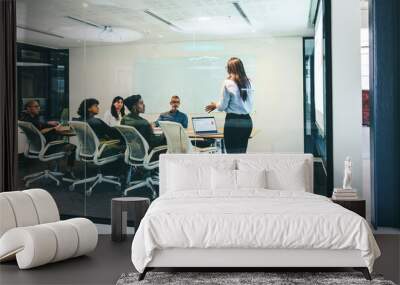 Smart businesswoman giving a financial presentation in a boardroom Wall mural