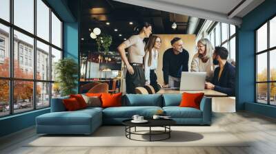 Smiling businesspeople having a discussion in an office Wall mural