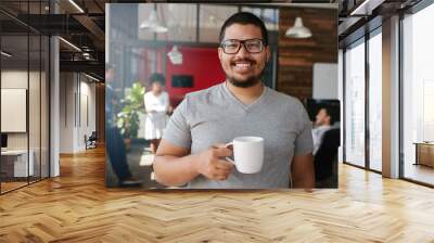 smiling creative professional having coffee in office Wall mural